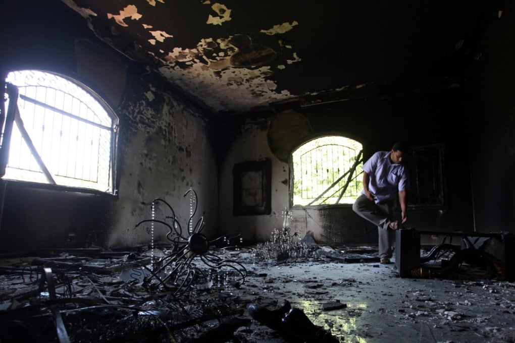 A Libyan man investigating the inside of the US Consulate in Benghazi, Libya, after an attack that killed four Americans, including ambassador Chris Stevens. Photo: AP