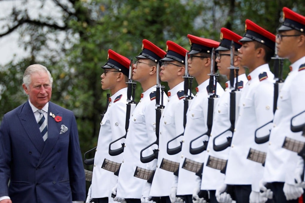 Britain's Prince Charles inspects an honour guard during a welcome ceremony in Singapore. Photo: Reuters