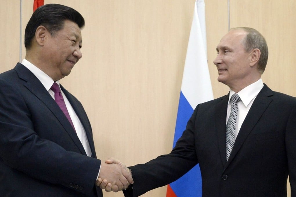 A joint China-Russia investment fund’s plan to invest in “dozens of deals” signals deepening financial ties between Beijing and Moscow and the growing relationship between Russian President Vladimir Putin (right) and President Xi Jinping. Photo: Agence France-Presse