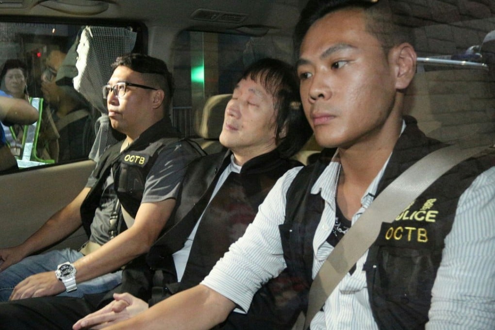 Kwok is driven away in police custody on Wednesday. Photo: SCMP Pictures