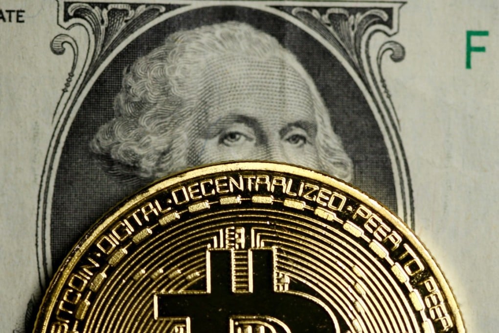 FILE PHOTO: A Bitcoin and dollar note are seen in this illustration picture taken September 27, 2017. REUTERS/Dado Ruvic/Illustration/File Photo