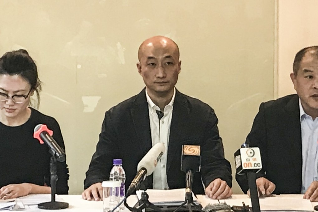 Qu Long (centre) talks to the media on Wednesday with his interpreter (left) and lawyer Mu Feng. Photo: Handout