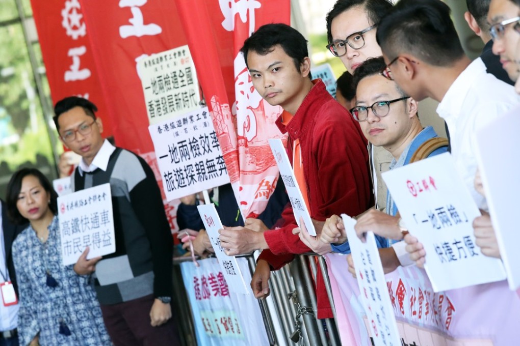 Members of Federation of Trade Unions gather outside the Legislative Council in Tamar to show support for the so-called co-location plan on Wednesday. Photo: K.Y. Cheng
