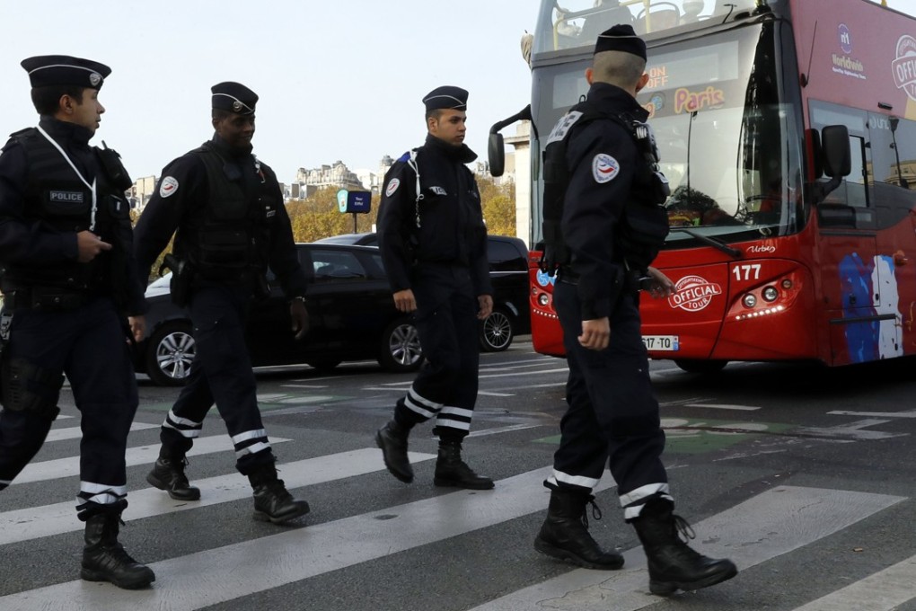 French police patrol in front of the Eiffel Tower in Paris. Photo: EPA