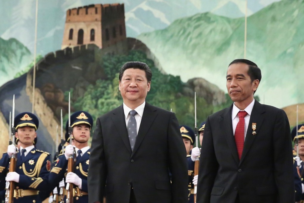 Chinese President Xi Jinping (left) accompanies Indonesia's President Joko Widodo during a welcoming ceremony inside the Great Hall of the People in Beijing in 2015. Photo: AFP