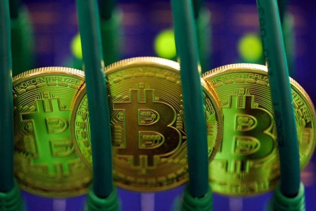 Bitcoins sit among Ethernet cables inside a communications room at an office in this arranged photograph in London, UK, on Tuesday, September 5, 2017. Bitcoin steadied after its biggest drop since June as investors and speculators reappraised the outlook for initial coin offerings. Photo: Bloomberg