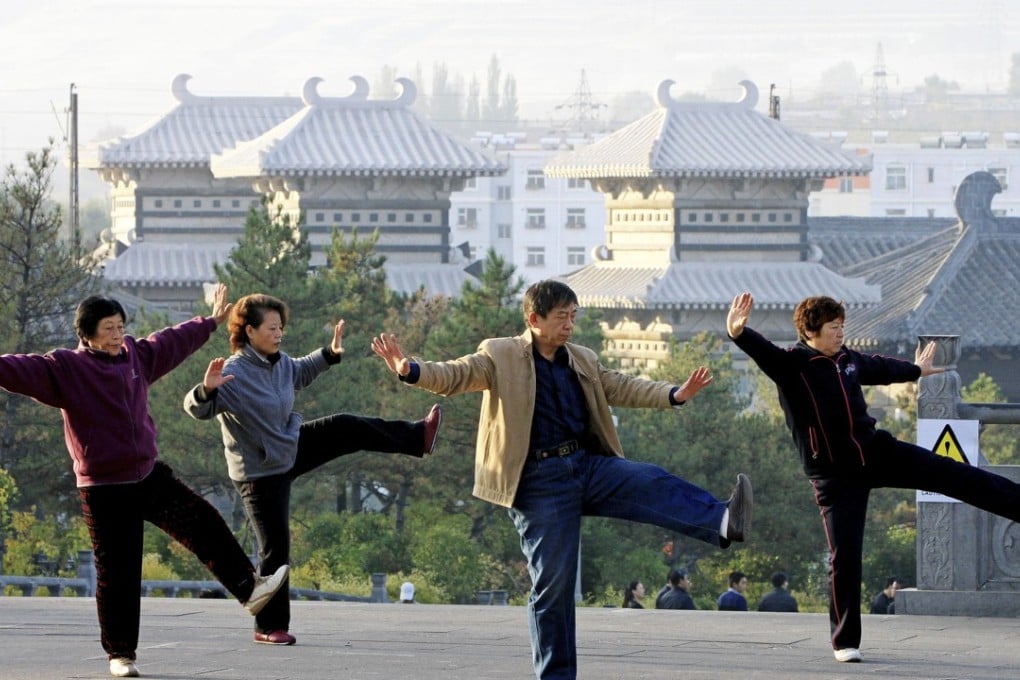 Chinese retirees perform tai chi exercises at a park in Datong city, Shanxi province. Photo: SCMP