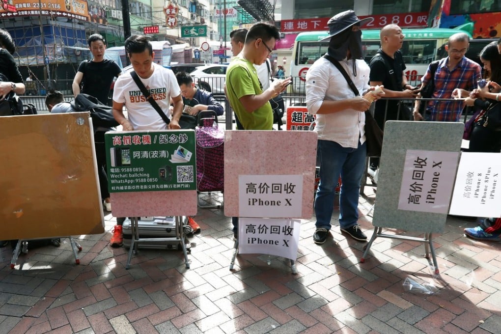 Traders outside Sin Tat Plaza in Mong Kok, waiting for people seeking to sell their new iPhone X. Photo: Nora Tam