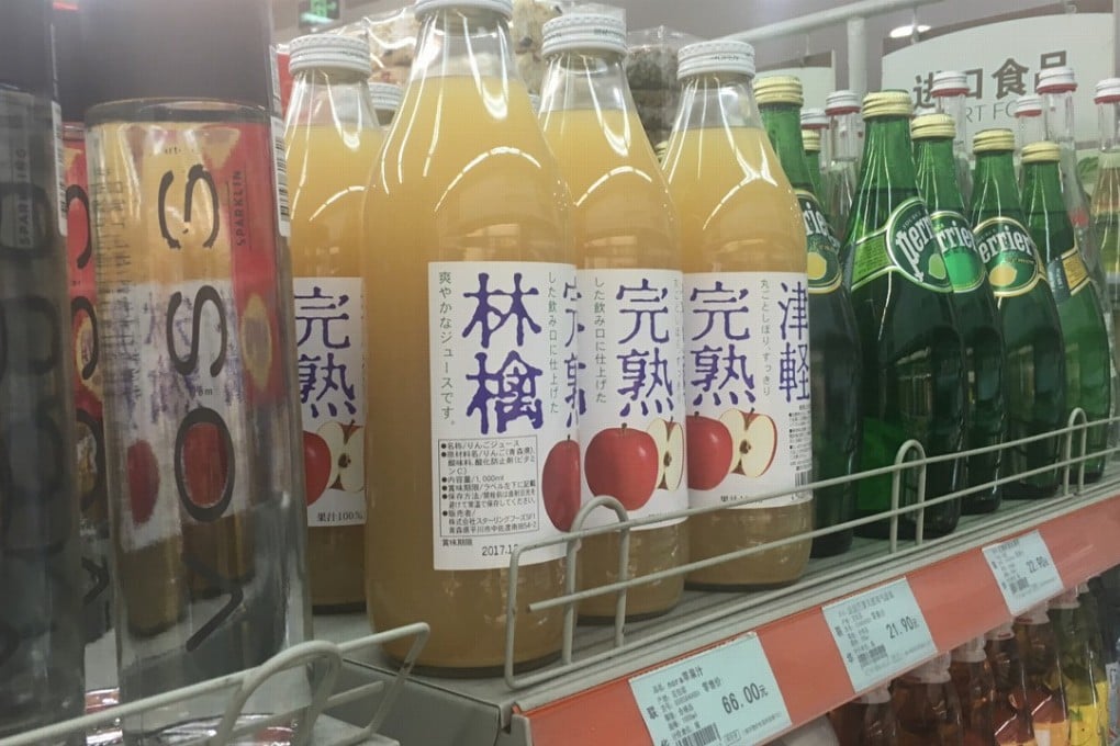 Nestle said China has displaced Japan in terms of sales of its premium bottled mineral water brand Perrier. Foreign brands populate a supermarket shelf in downtown Shanghai. Photo: Maggie Zhang