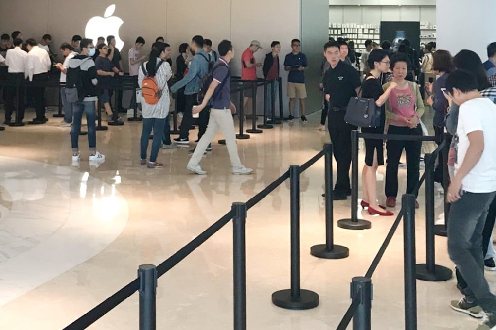 Buyers with a successful pre-order lining up, quietly, outside the Apple Store in Shenzhen to pick up their new iPhone X handsets. Photo: /Li Tao