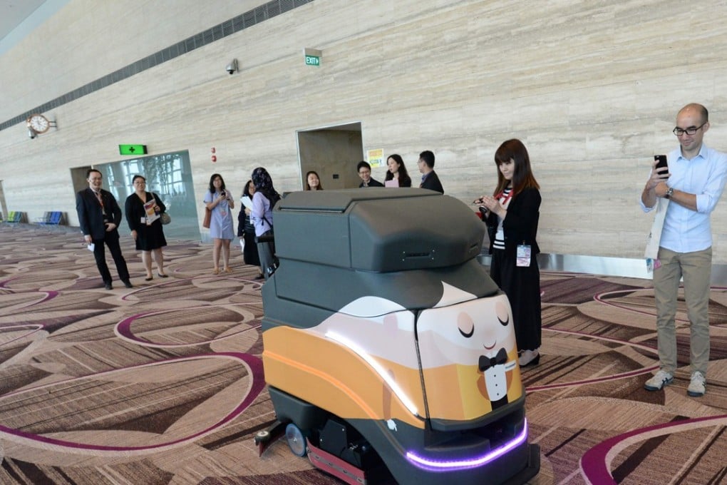 A robot vacuum cleaning the floor during a media tour at the newly built Changi Airport Terminal 4 in Singapore. Photo: AFP