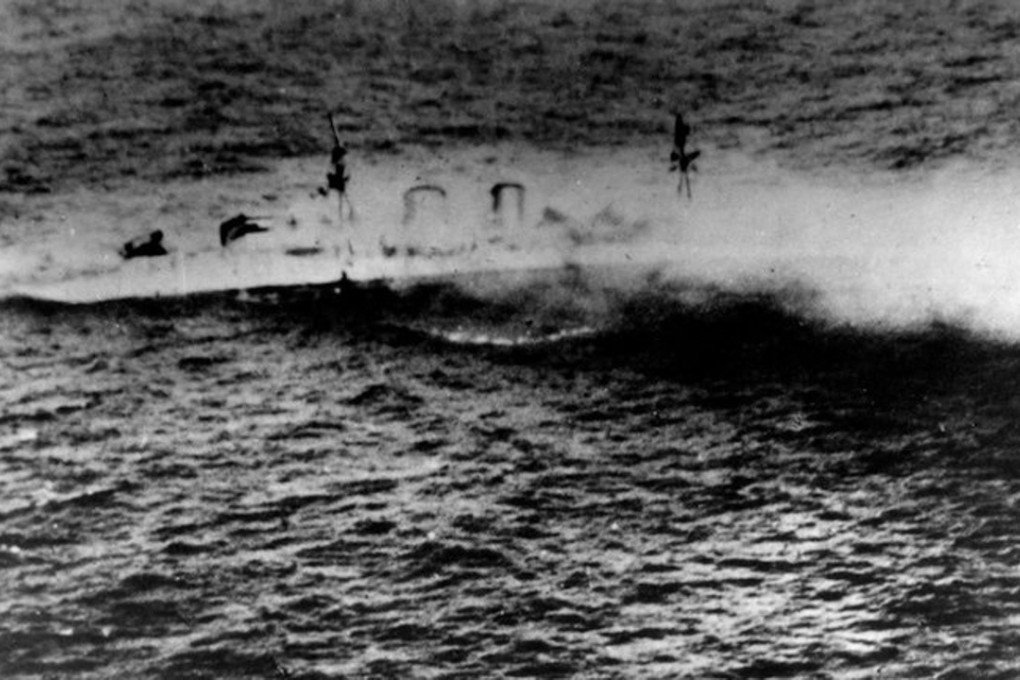 The Royal Navy heavy cruiser HMS Exeter sinking during an operation in the Java Sea on 1 March 1942. The shipwreck has been plundered by scavengers. Photo: US Naval History and Heritage Command