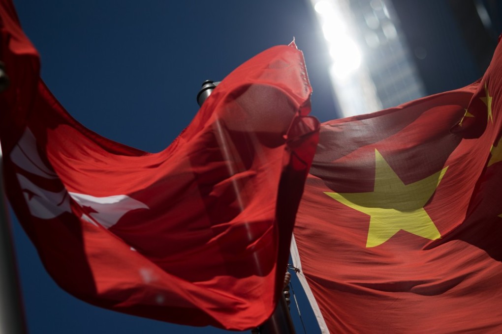 The Hong Kong SAR and Chinese national flags are displayed in Central district, Hong Kong. Nation-building should be promoted as a shared project binding people together. Photo: EPA-EFE