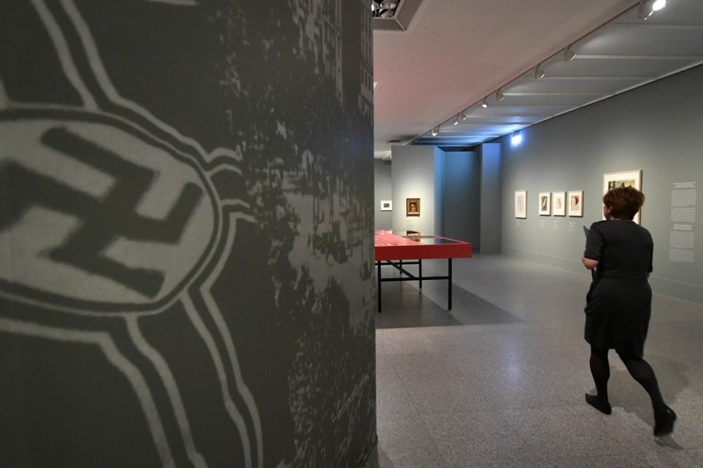 A visitor enters the exhibition 'Gurlitt: Status Report' in Bonn, Germany, on Thursday, November 2, 2017. Bundeskunsthalle museum is presenting some 250 art works from the 1,500-piece collection hoarded for decades by the late collector Cornelius Gurlitt, including pieces likely looted from Jewish owners under Nazi rule. Photo: AP