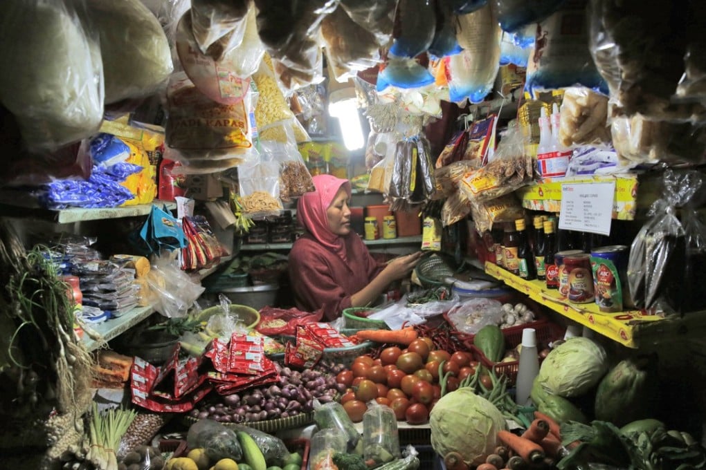A vegetable vendor at a traditional market in Jakarta. The Asean countries represent an attractive young market that is likely to attract more venture-investing. Photo: EPA