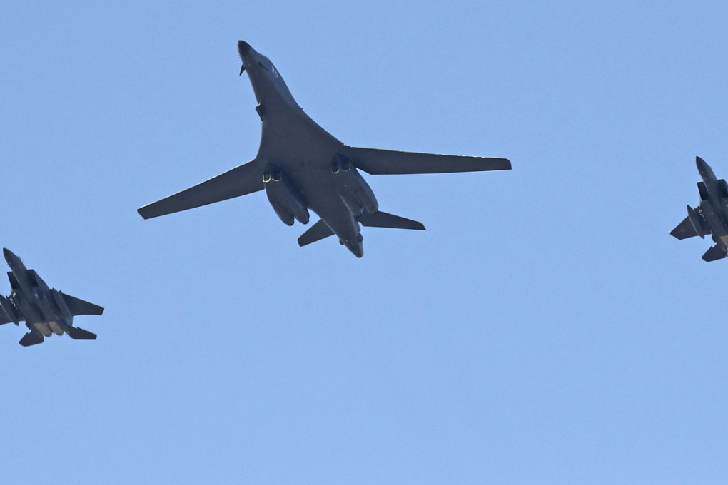 A US Air Force B-1B bomber, centre, and two South Korean fighter jets fly over the Seoul Airport on October 21. Photo: AP