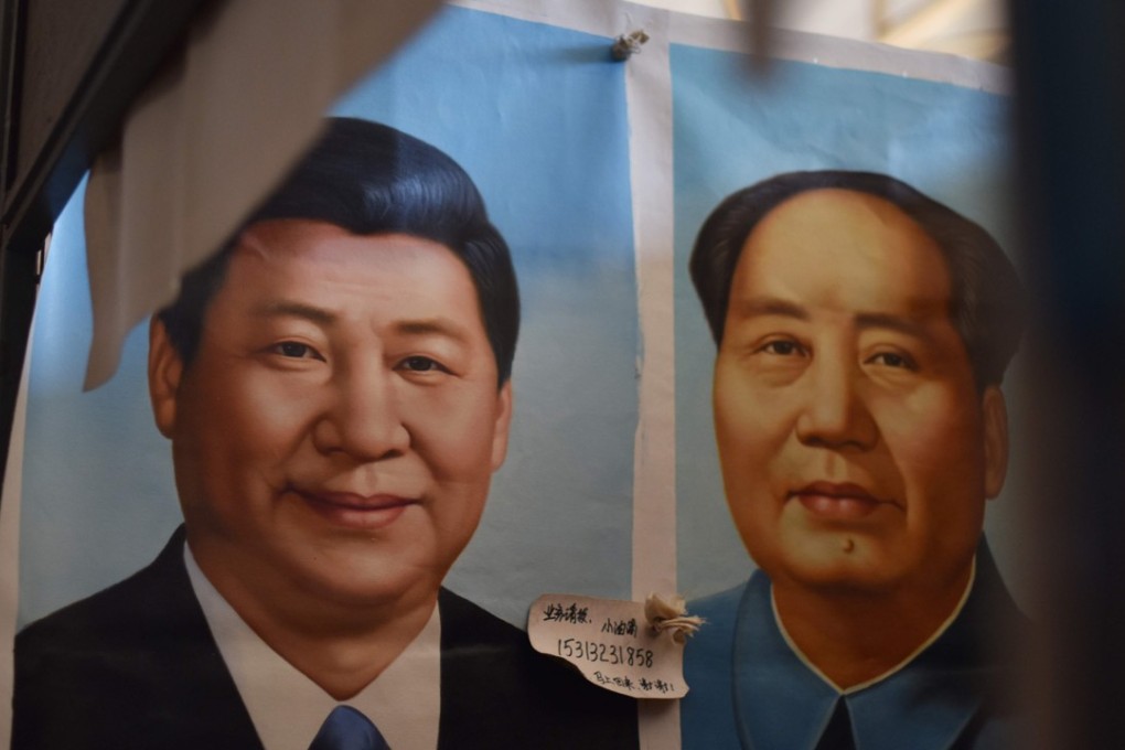 Portraits of Chinese President Xi Jinping (L) and late communist leader Mao Zedong at a market in Beijing. Xi’s decision not to elevate a designated successor at the party’s latest congress breaks with a 25-year tradition. Photo: AFP