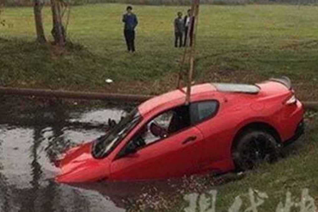 A crane pulls the US$300,000 Maserati sports car from a pond in Nanjing. The driver said she lost control of the high-powered vehicle after swerving to avoid a truck. Photo: News.qq.com