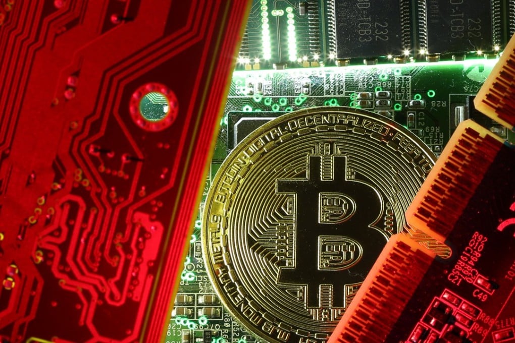 A copy of bitcoin standing on PC motherboard is seen in this illustration picture, October 26, 2017. Photo: Reuters