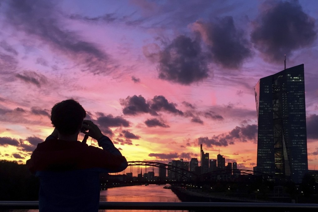 The sun sets behind the European Central Bank headquarters in Frankfurt, Germany. The ECB is already hinting at the need to switch the focus to fiscal policy as the next big fix in a major downturn. Photo: AP