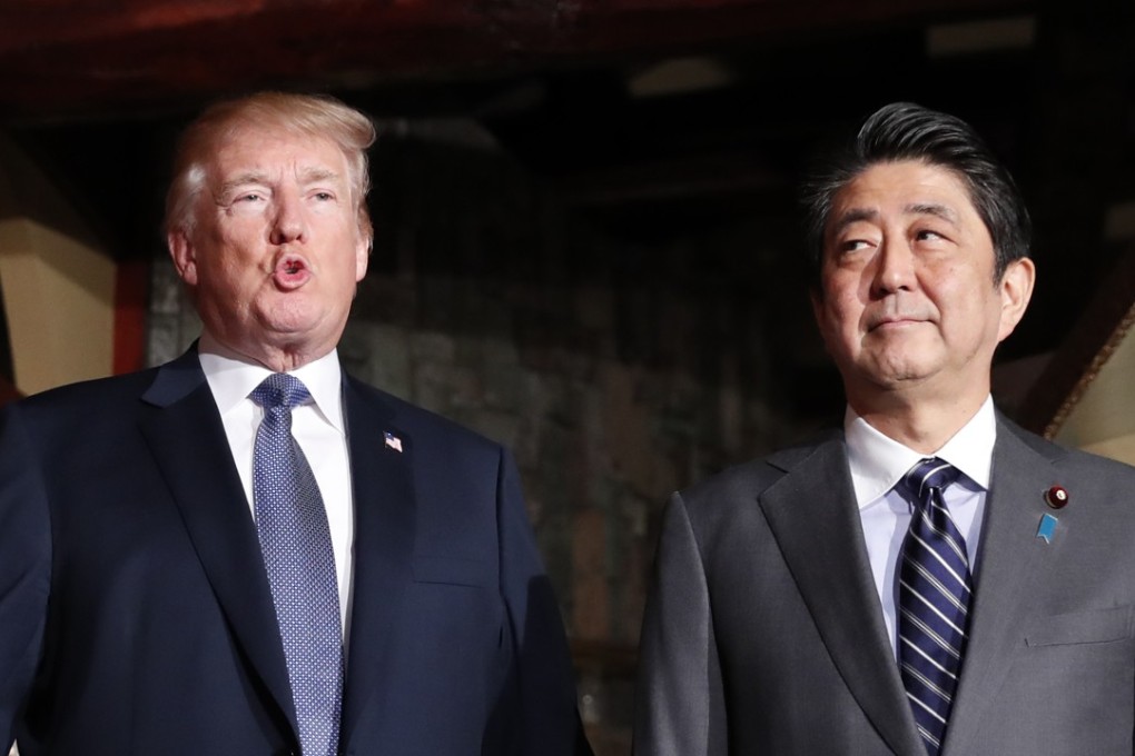 US President Donald Trump and Shinzo Abe, Japan's prime minister, arrive at the Uka-Tei restaurant in Tokyo. Photo: Bloomberg