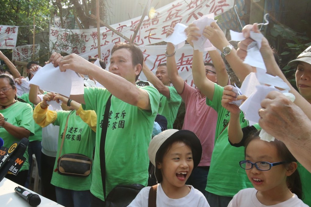 Residents from Wang Chau meet the media at a demonstration against the housing project. Photo: David Wong