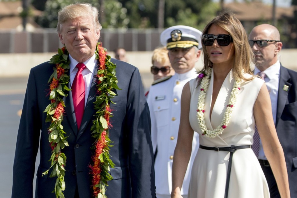 US President Donald Trump and first lady Melania Trump wear leis as they arrive at Joint Base Pearl Harbor Hickam in Hawaii. Photo: AP