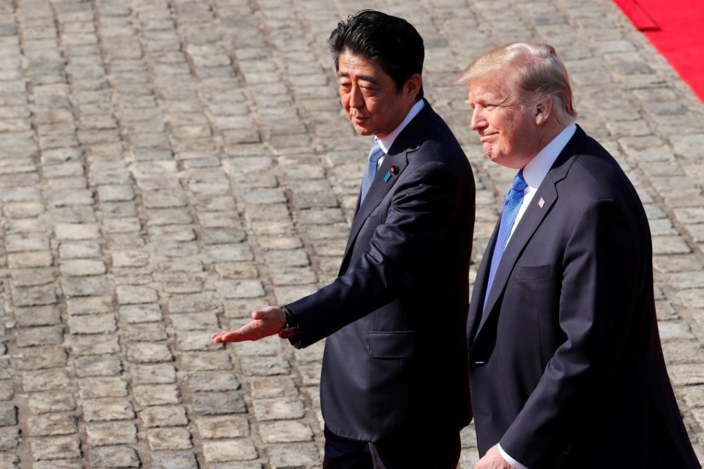 US President Donald Trump and Japan's Prime Minister Shinzo Abe arrive at the Akasaka Palace in Tokyo on Monday. Photo: Reuters