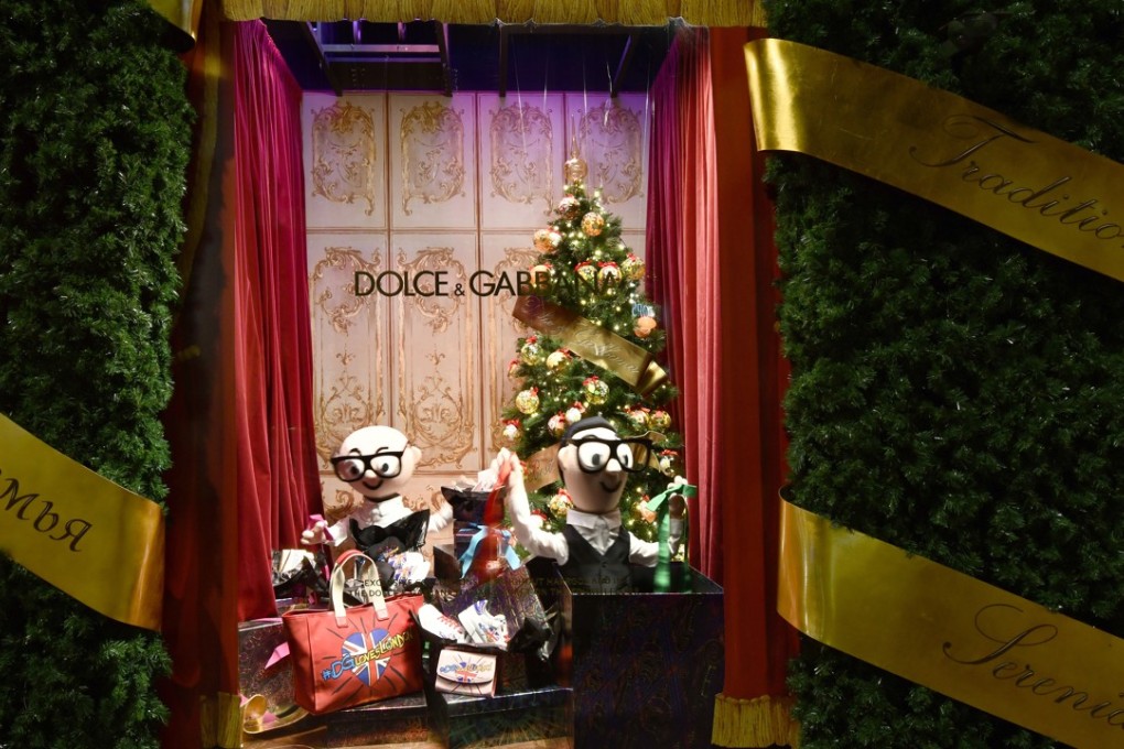 Caricatures of Domenico Dolce (left) and Stefano Gabbana feature in a Christmas window dressing in Harrods.