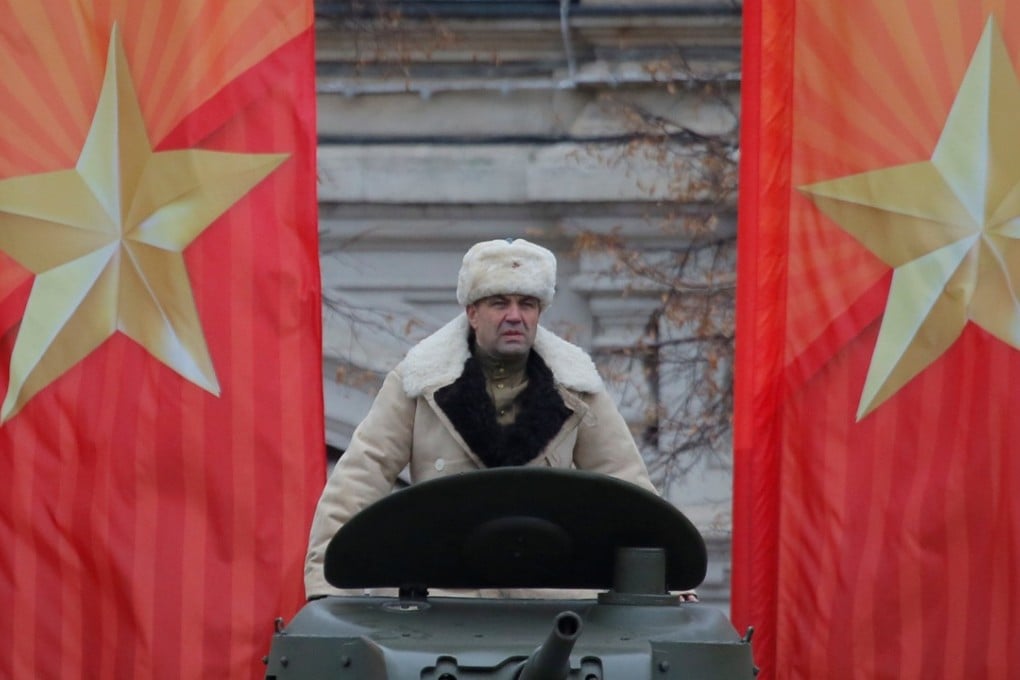 A participant dressed in historical uniform takes part in the military parade at Red Square in Moscow. Photo: Reuters