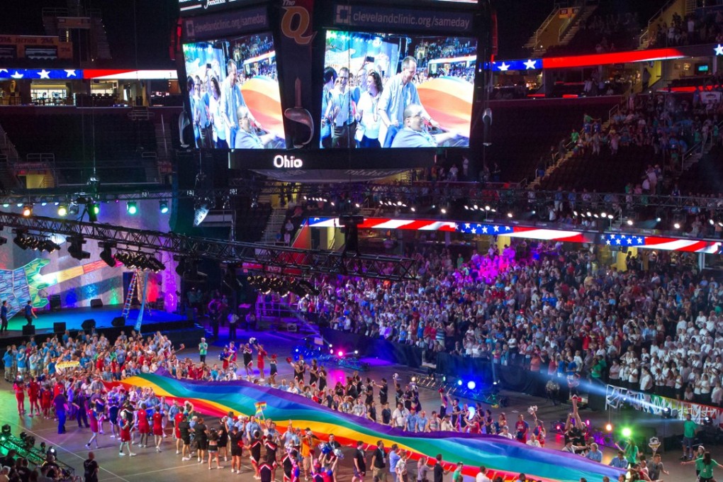 Competitors file into the Quicken Loans Arena in Cleveland, Ohio for the opening ceremony of the Gay Games 2014. Photo: Alamy