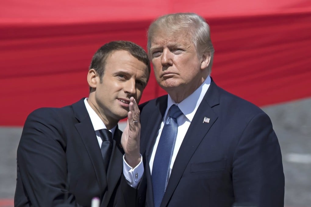French President Emmanuel Macron talks to US President Donald Trump during Bastille Day celebrations in Paris, France, in July 2017. Photo: EPA