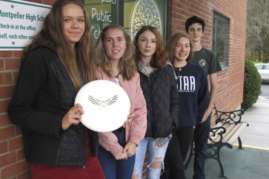 Ultimate frisbee players, from left, Emma Harter, Appolonia Tabacco, Sophia Currier, Casarah Acosta and Gavin-Corbett-Valade pose in front of their school at Montpelier High School in Montpelier, Vermont. Vermont is now the first state in the United States to recognise “ultimate” – the game that started as Ultimate Frisbee – as a high school varsity sport. Photo: AP
