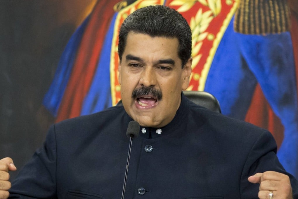 Venezuela's President Nicolas Maduro speaks during a press conference at the Miraflores presidential palace, in Caracas, Venezuela. US sanctions are pushing Venezuela to the brink of a debt default. Photo: AP