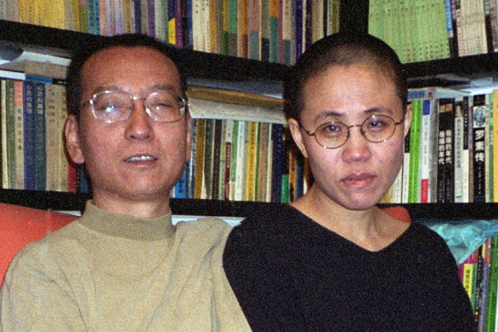 Campaigners are calling for the release of Liu Xia, pictured with her Nobel laureate husband Liu Xiaobo in 2002, who has yet to be given her freedom four months after her husband’s death. Photo: AFP
