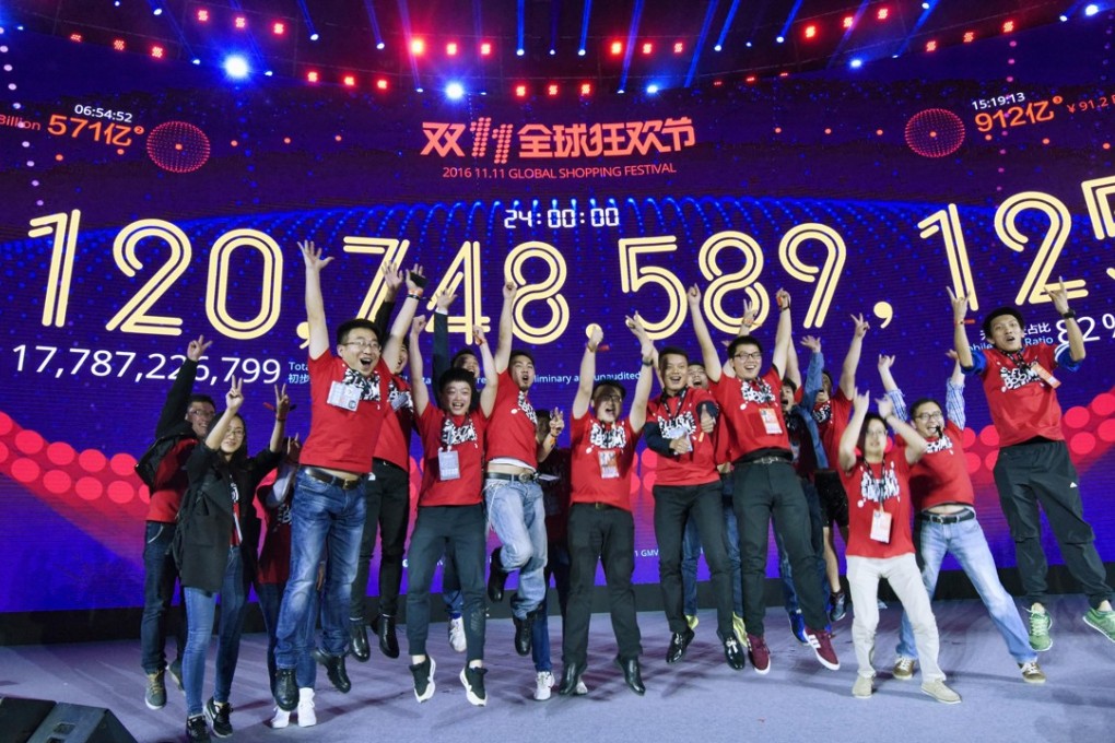 Alibaba staff celebrate reaching 120.7 billion yuan in sales at last year’s Singles’ Day event. Photo: Kyodo