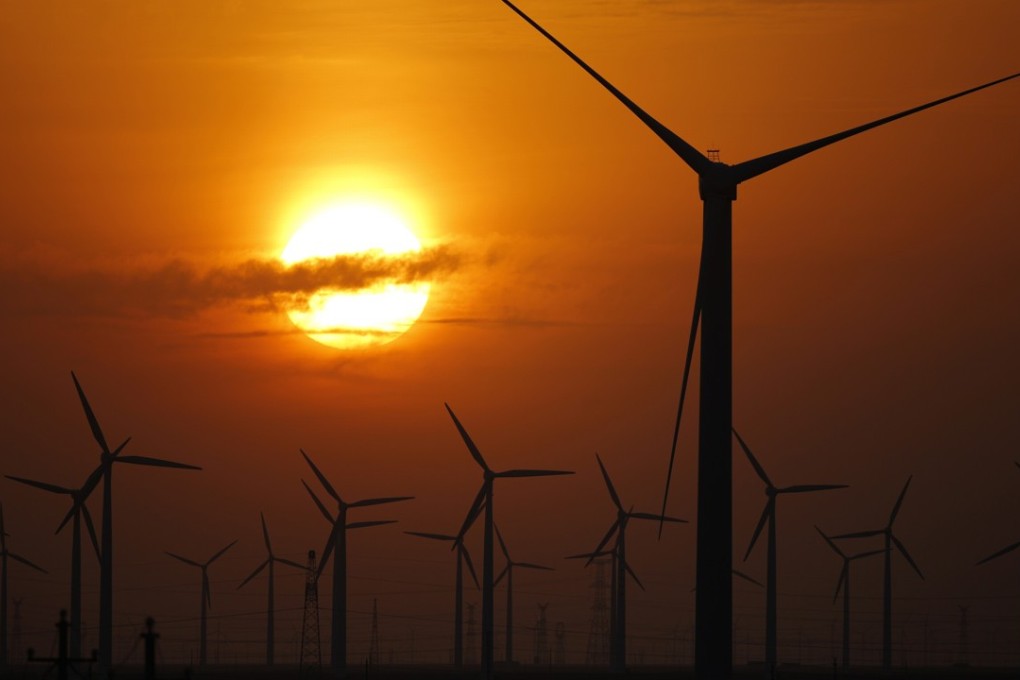 Turbines used to generate electricity are seen at a wind farm in Guazhou, in Gansu province. China has been investing in wind power, which is more cost-competitive than solar energy and partly able to compete with coal and gas. Photo: Reuters