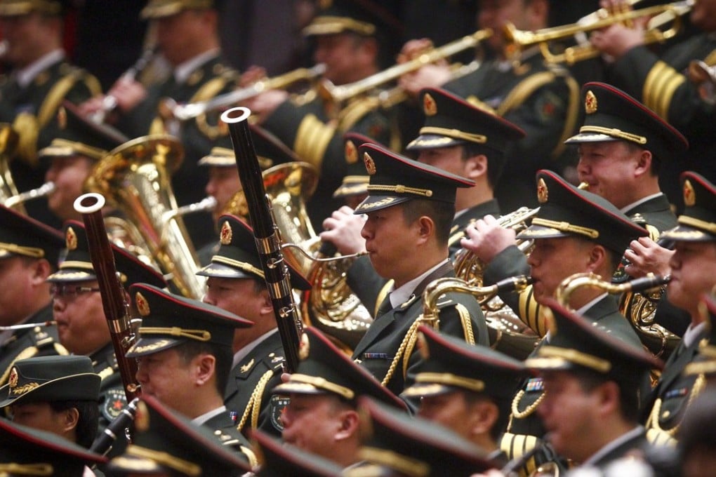 Members of a military band of the People’s Liberation Army play the Chinese national anthem in Beijing. Photo: EPA