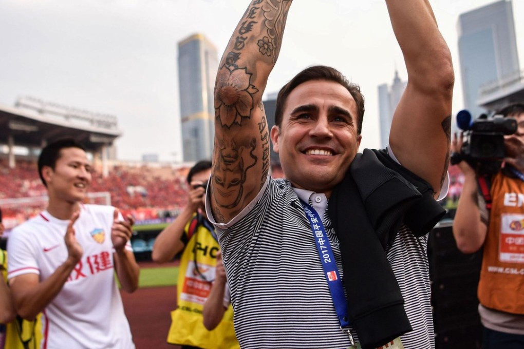 Fabio Cannavaro applauds the Tianjin Quanjian fans after his final game in charge, a victory against Guangzhou Evergrande. Photo: AFP
