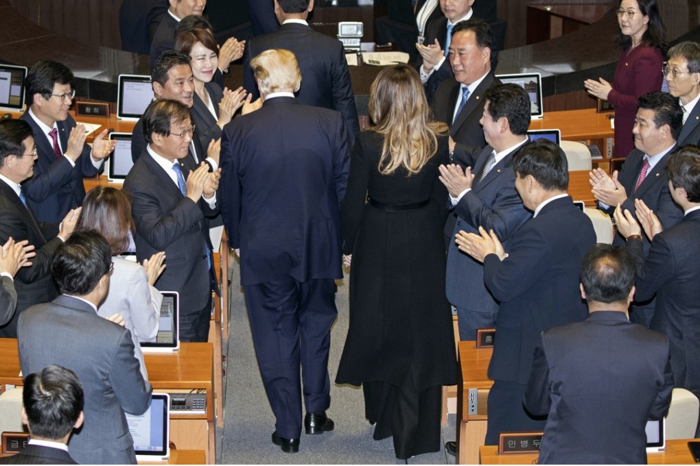 South Korean legislators applaud US President Donald Trump and First Lady Melania Trump at the National Assembly in Seoul on Wednesday. In a speech before the assembly, the first by a US president in nearly a quarter-century, Trump could hardly contain his praise for the close US ally. Photo: Pool via Bloomberg