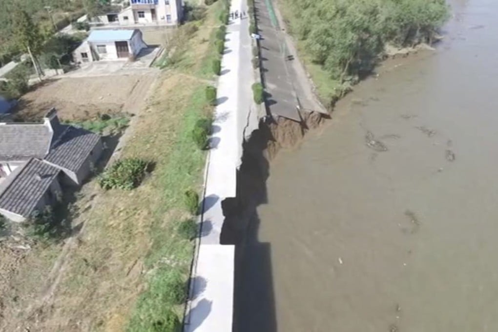 The floodwaters washed away a section of the embankment in Yangzhong city, Jiangsu province. Photo: Handout