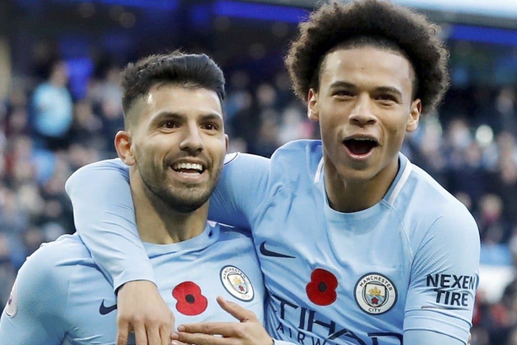 Sergio Aguero (left) celebrates with Leroy Sane after scoring against Arsenal. Photo: AP