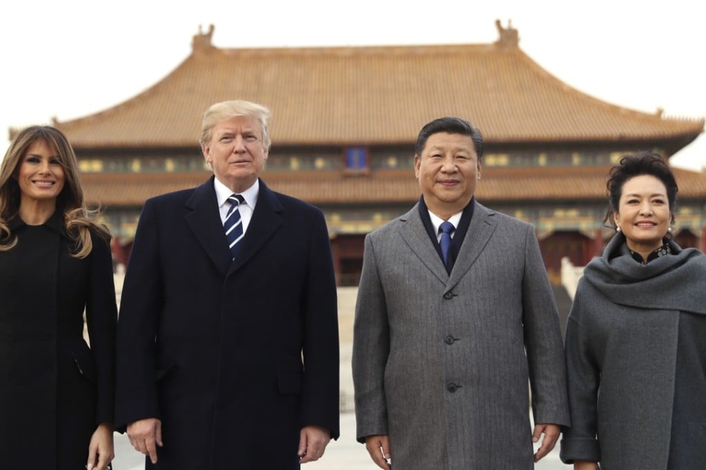 President Xi Jinping and wife Peng Liyuan stands with US president Donald Trump and US first lady Melania Trump as they tour the Forbidden City on Wednesday. Photo: AP