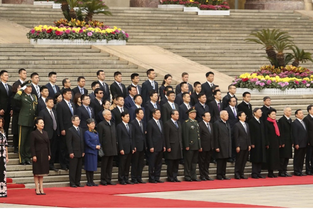 US first lady Melania Trump (left) and her counterpart Peng Liyuan watch as US President Donald Trump and President Xi Jinping take part in a welcoming ceremony at the Great Hall of the People. Photo: AP
