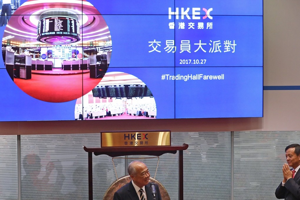 HKEX chairman Chow Chung-kong (left) and Chief Executive Charles Li Xiaojia attend a farewell ceremony last month to mark the end of floor trading at the HKEX. Photo: Edward Wong