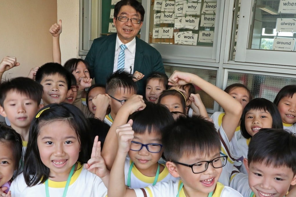 Principal Alan Chow with pupils at W F Joseph Lee Primary School. Photo: K. Y. Cheng