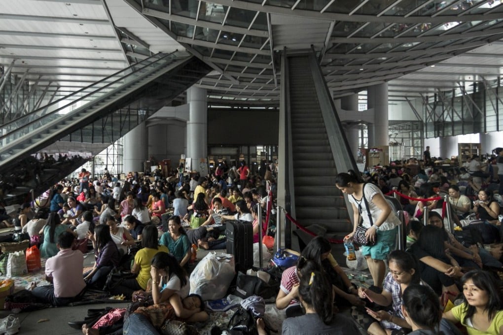 Foreign domestic helpers gathered under the HSBC building on a Sunday in Central district. Photo: Thomas Lee