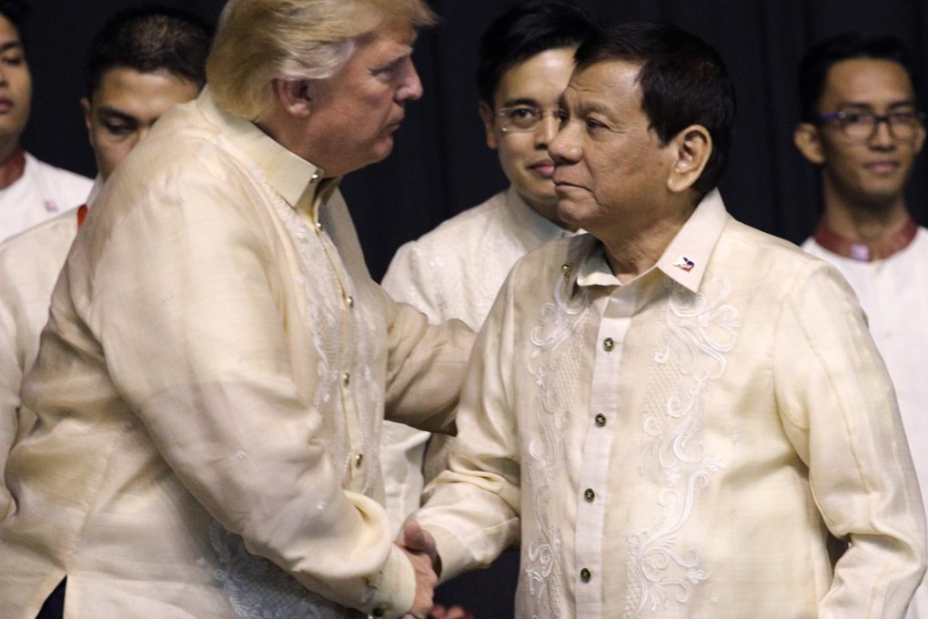 US President Donald Trump shakes hands with Philippines President Rodrigo Duterte during a special gala celebration dinner for the Association of Southeast Asian Nations in Manila on November 12, 2017. Photo: AFP