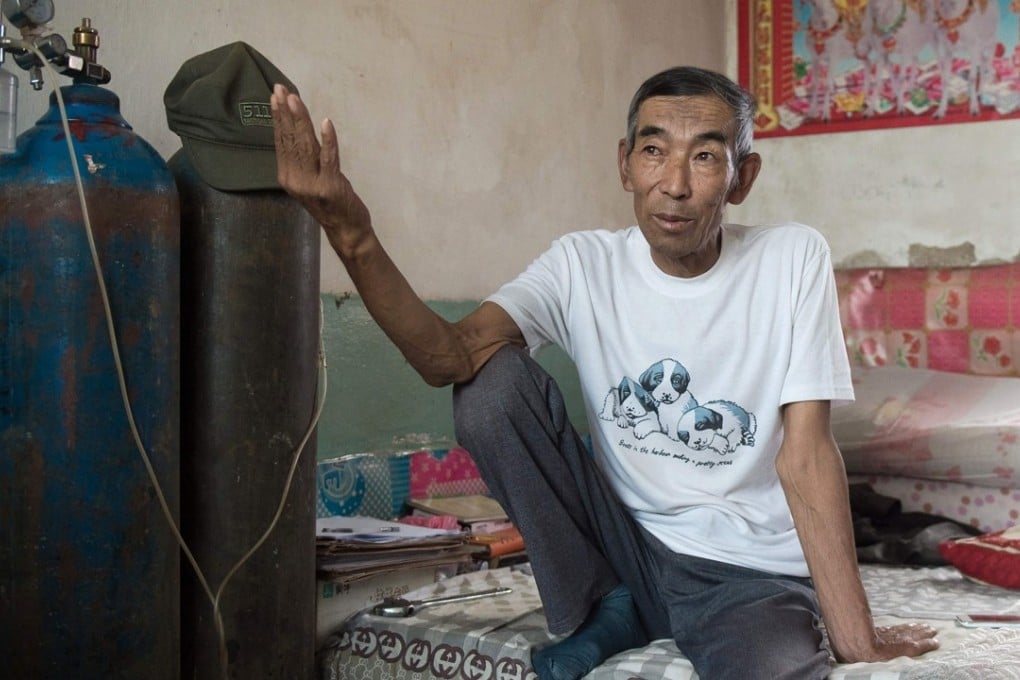 Wang Enlin, 64, suffers from breathing problems but refuses to be defeated by China’s big business. He prepares his own legal paperwork and hosts daily gatherings at his home for villagers hoping to learn about their rights. Photo: AFP