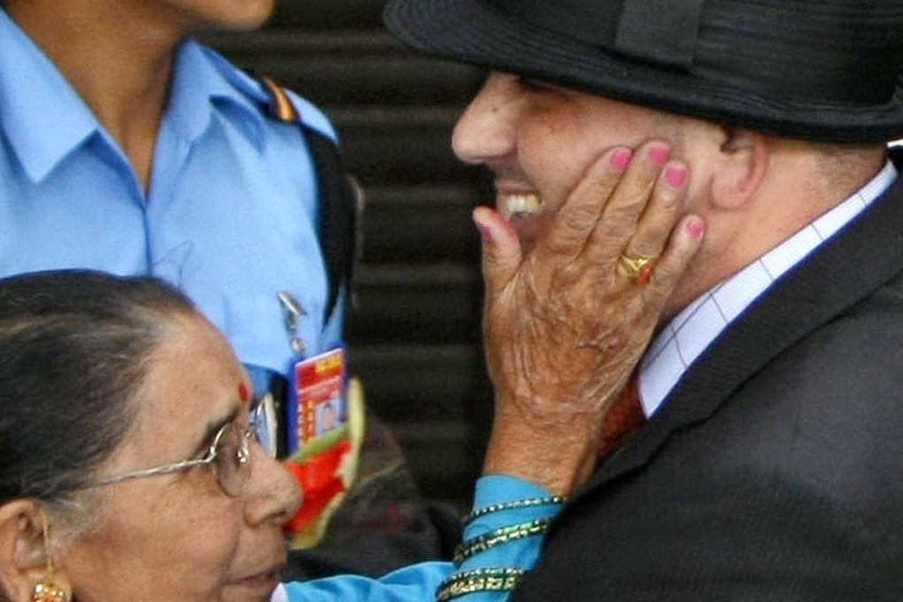 Govinda Prasad Mainali is greeted by his mother Chandra Kala Mainali upon his arrival at the airport in Kathmandu, Nepal after his release from jail in 2012. File photo: AP